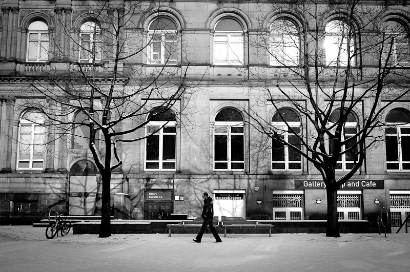 man walking on the snow in library of leeds